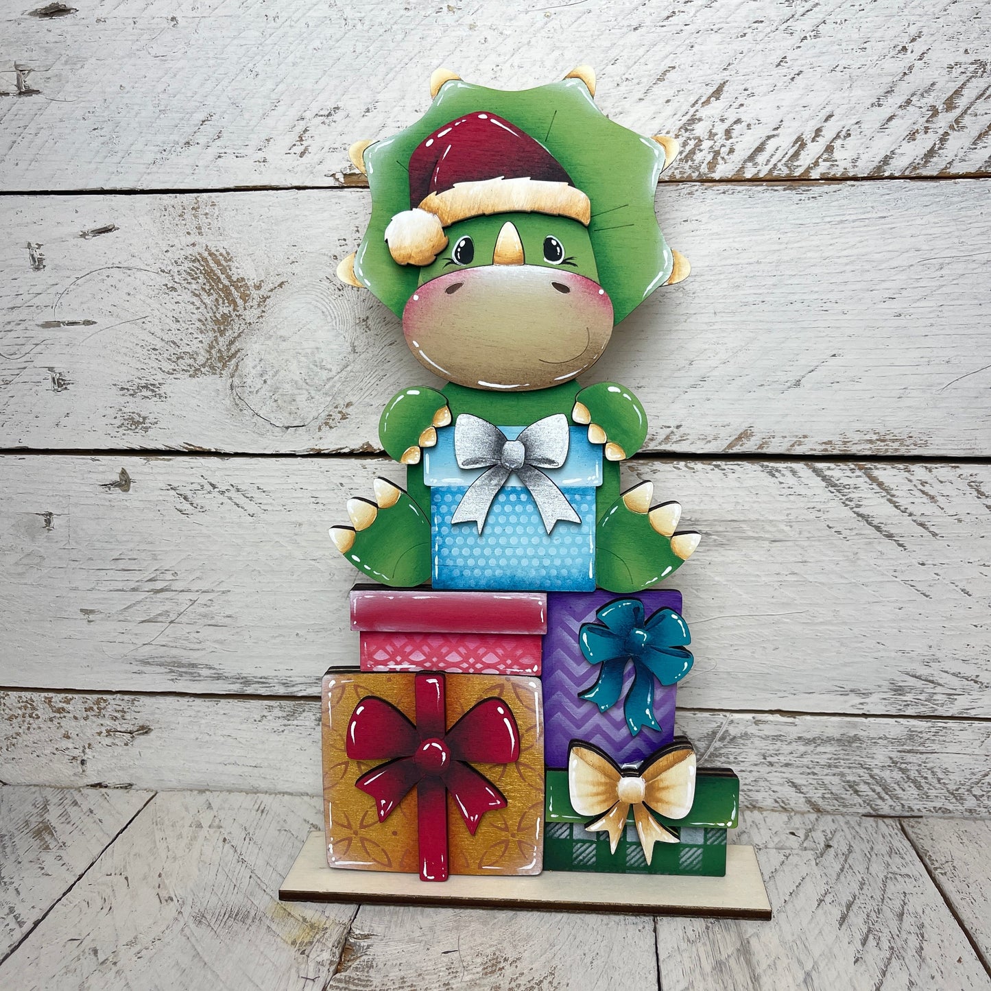 Dinosauro con pacchi regalo per casetta degli uccellini Out of the Wood