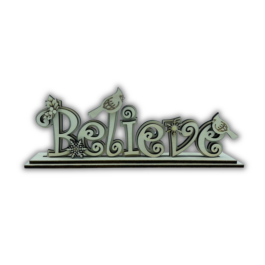 Scritta “BELIEVE” Out of the Wood