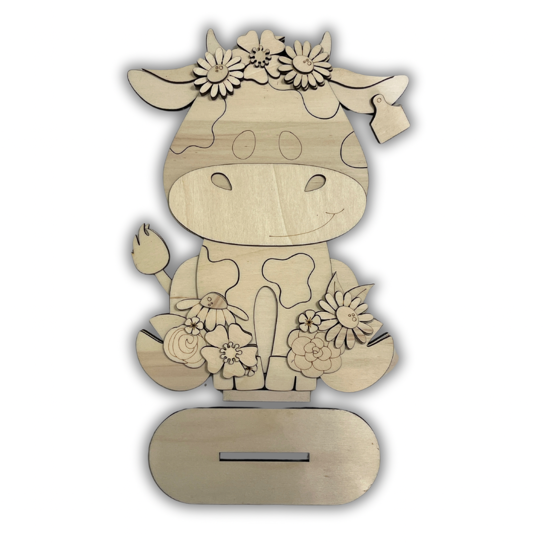 Mucca con fiori Out of the Wood