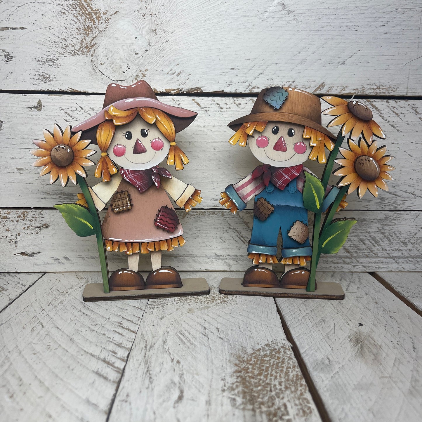 Spaventapasseri con girasoli Out of the Wood