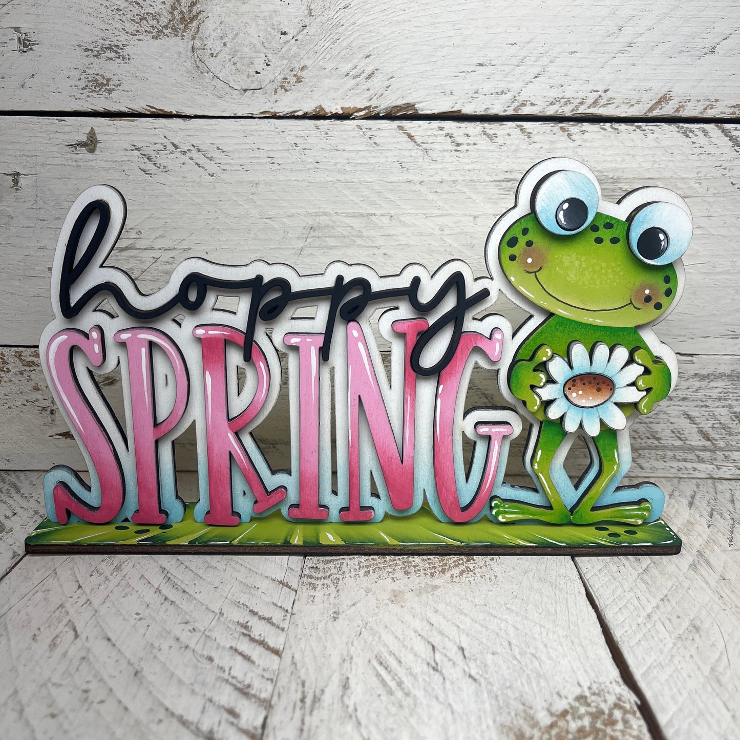 Scritta Hoppy spring Out of the Wood