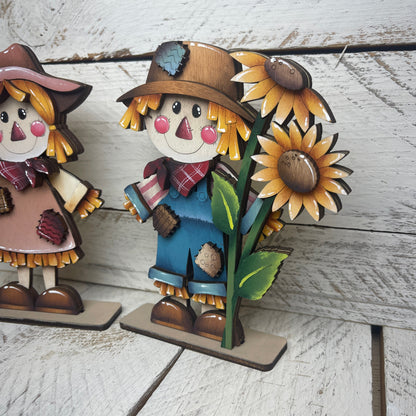 Spaventapasseri con girasoli Out of the Wood