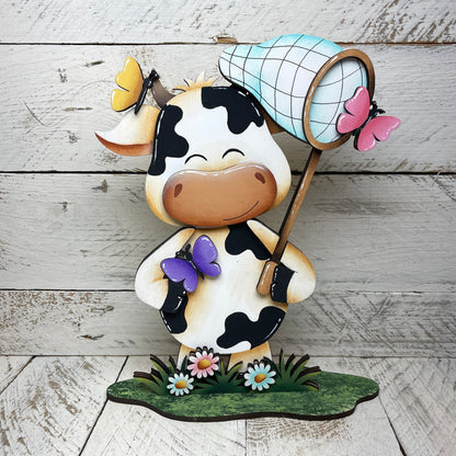 Mucche primaverili con piedistallo Out of the Wood