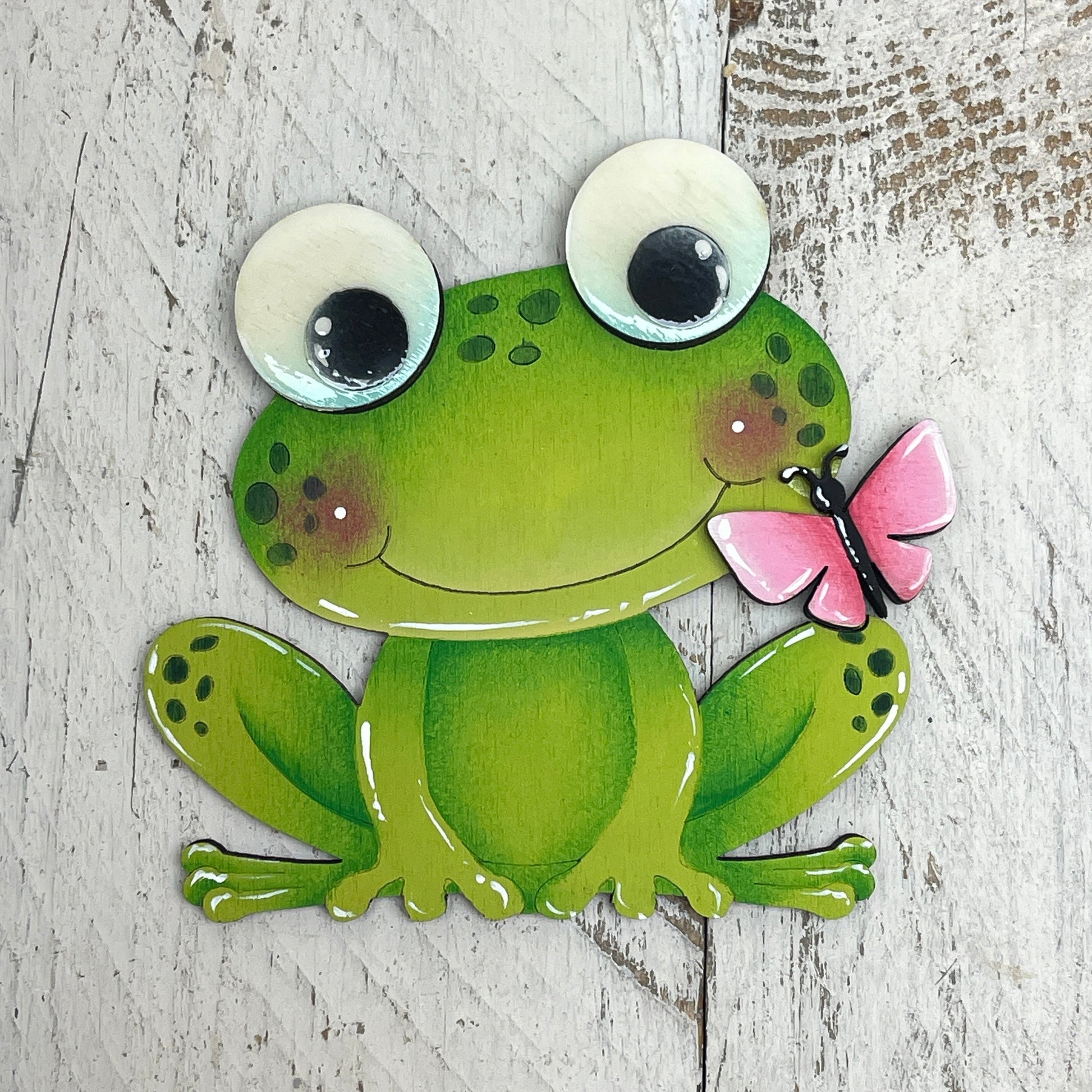 Rana con farfalla Out of the Wood