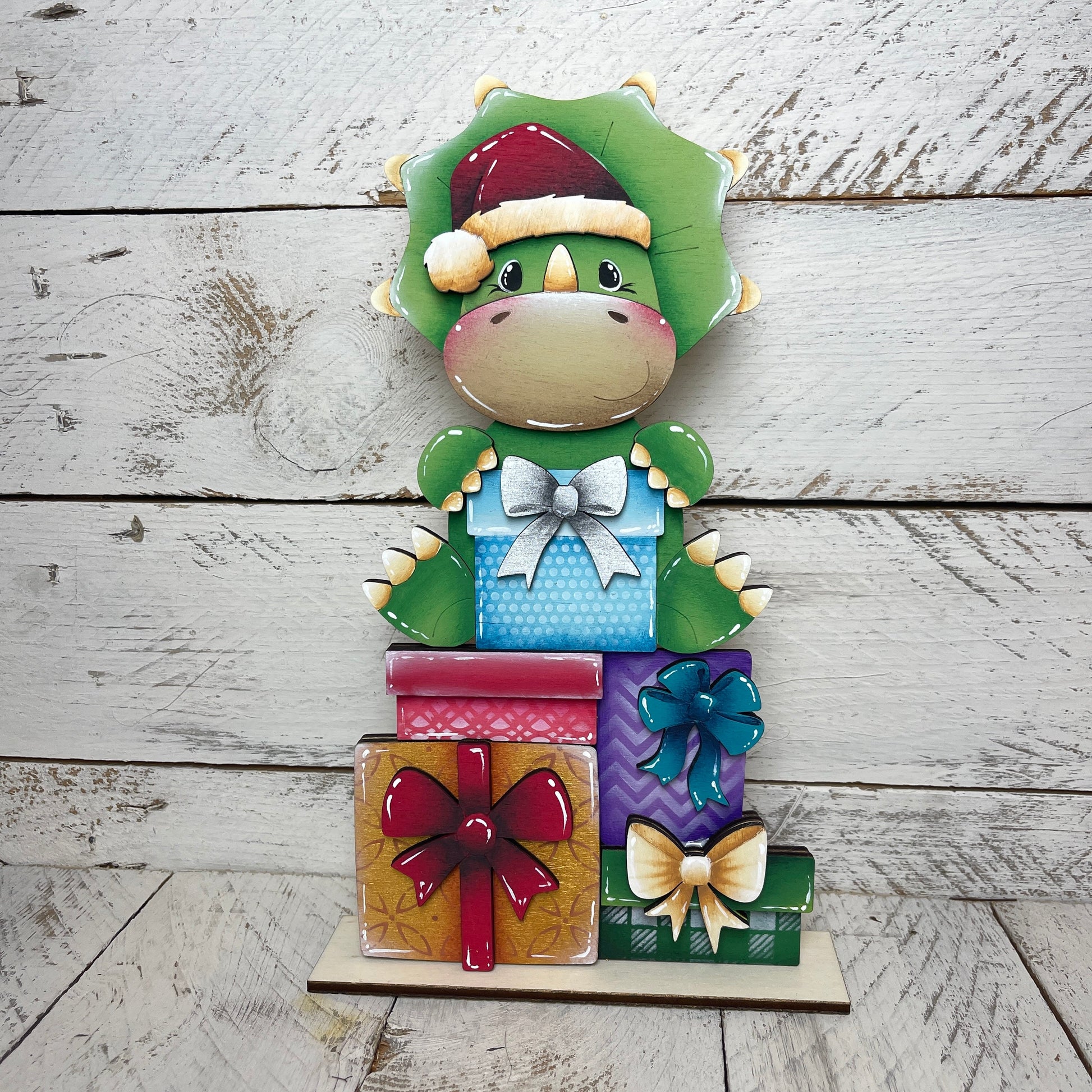 Dinosauro con pacchi regalo  per casetta degli uccellini Out of the Wood
