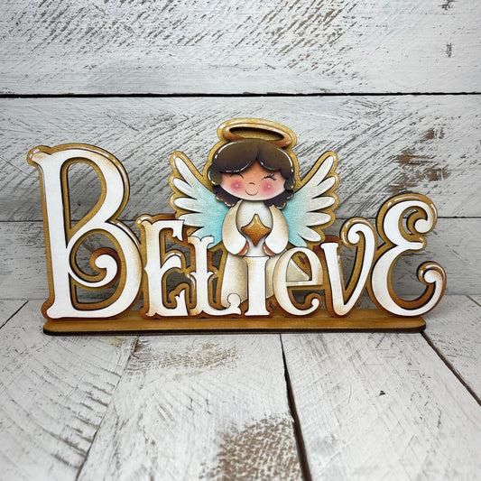 Scritta Believe Out of the Wood