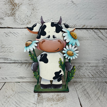 Mucca con fiori Out of the Wood
