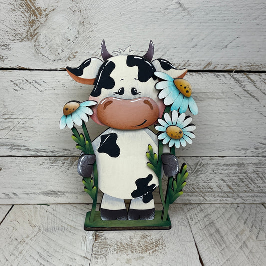 Mucca con fiori Out of the Wood