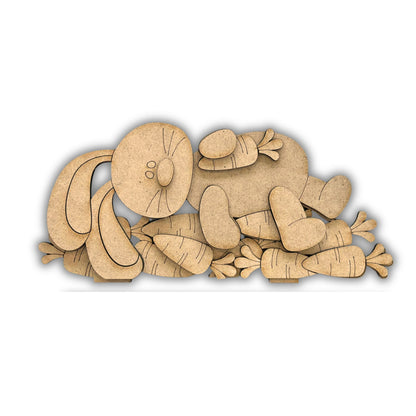 Coniglio disteso su carote Out of the Wood