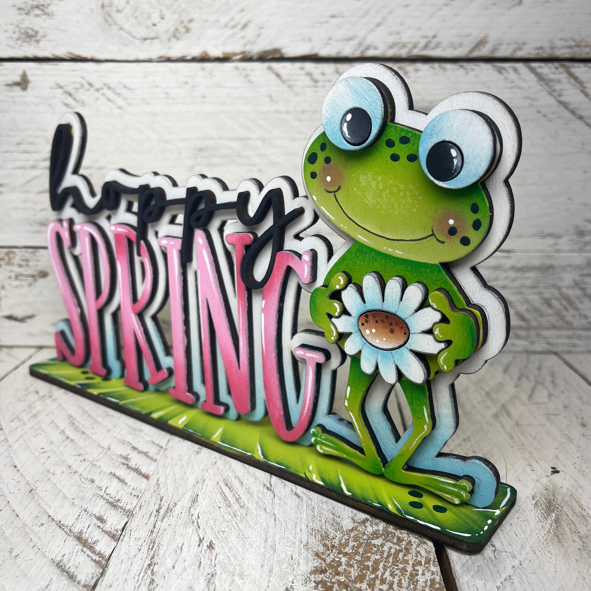 Scritta Hoppy spring Out of the Wood