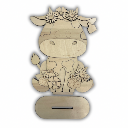 Mucca con fiori Out of the Wood