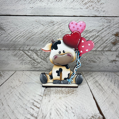Mucche San Valentino con piedistallo Out of the Wood