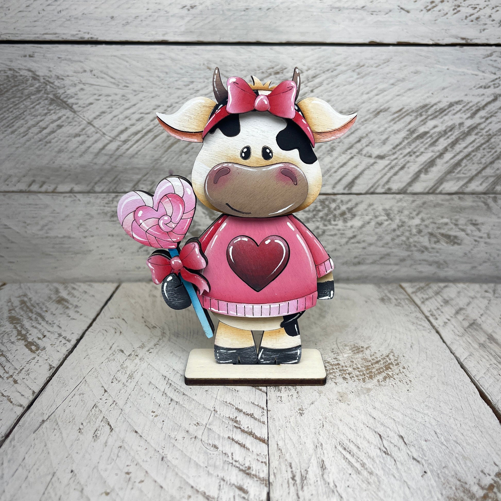 Mucche San Valentino con piedistallo Out of the Wood