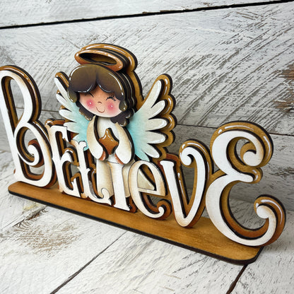 Scritta Believe Out of the Wood