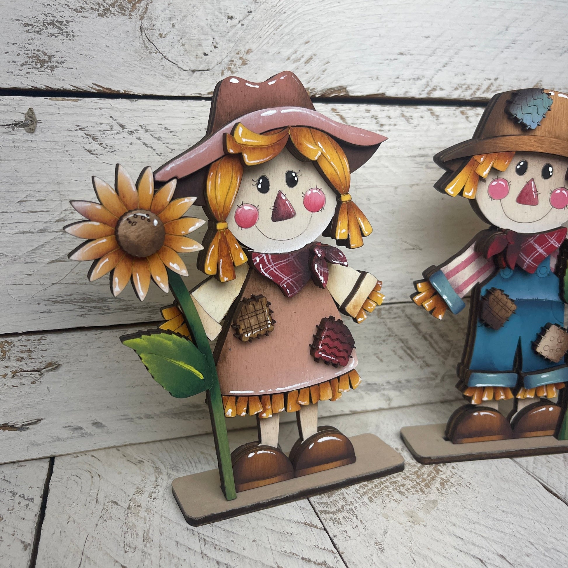 Spaventapasseri con girasoli Out of the Wood