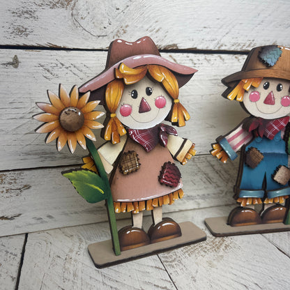 Spaventapasseri con girasoli Out of the Wood