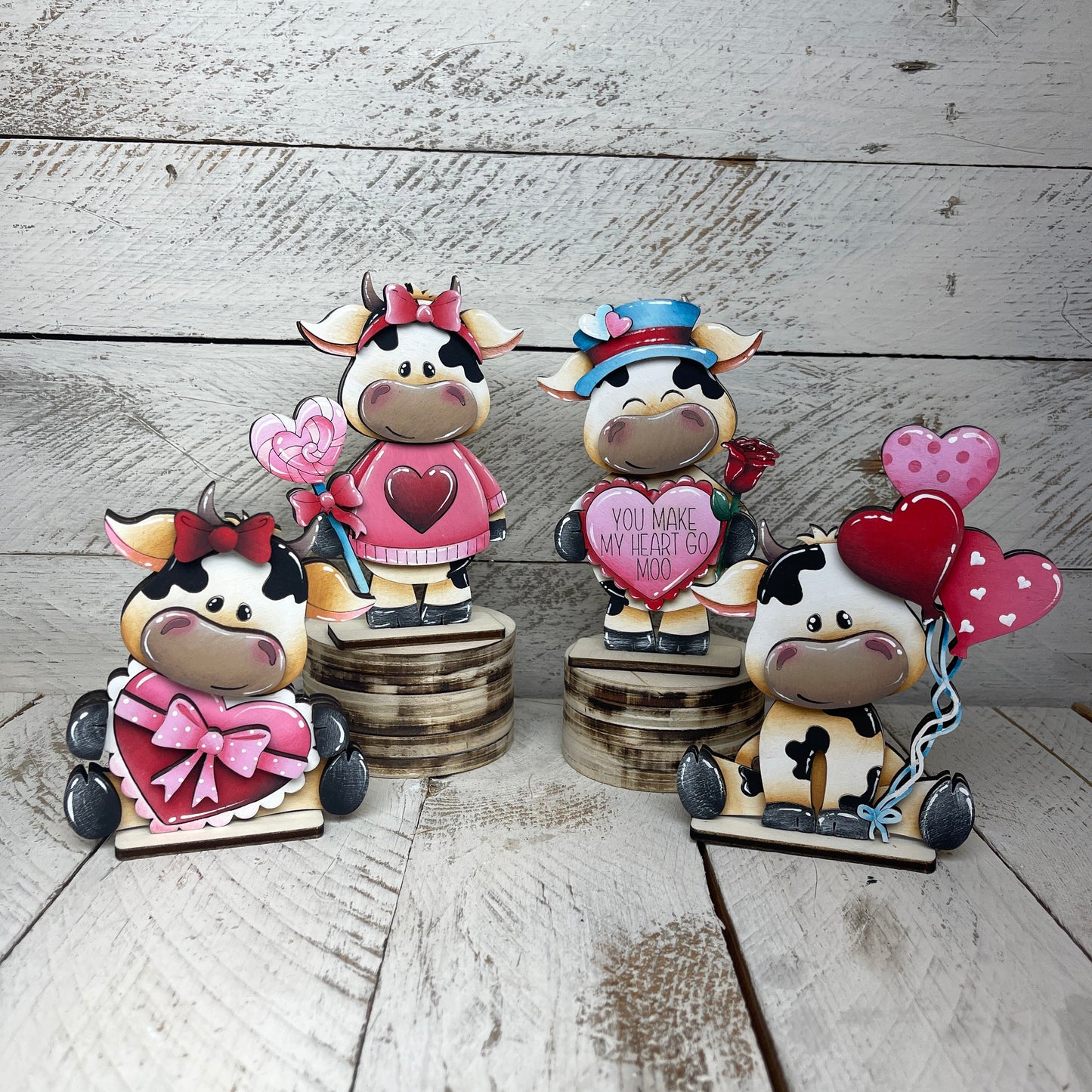 Mucche San Valentino con piedistallo Out of the Wood