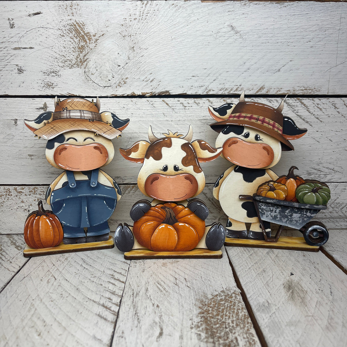Mucche autunno con piedistallo Out of the Wood