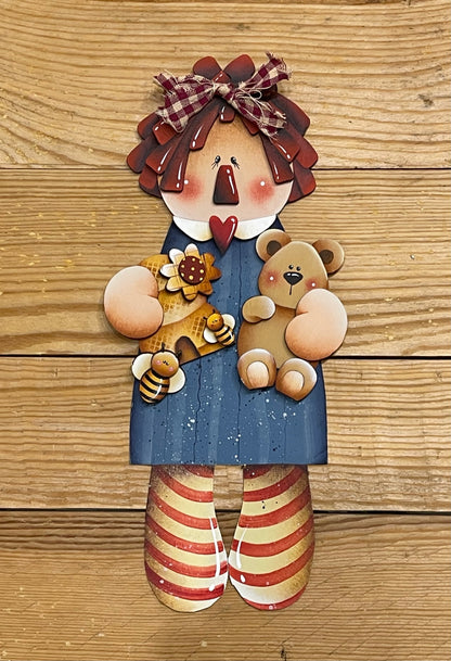 Raggedy  Ann Out of the Wood